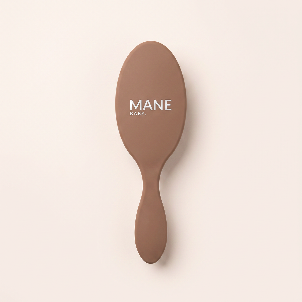 Mane Baby Original Boar Bristle Brush, logo side up, showing the full-size oval paddle and long tapered handle in warm brown